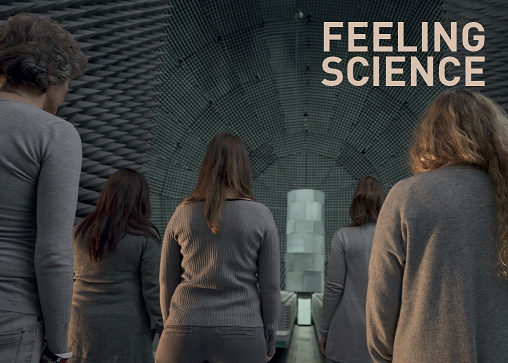 feeling science promotional picture - text displayed above women facing the anechoic chamber