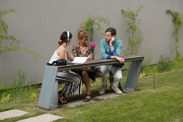 Group of summer school participants sitting down and recording a podcast
